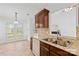 Eat-in kitchen featuring double sink, granite countertops, and backyard view at 3002 Enderbury Dr, Indian Trail, NC 28079