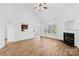 Bright living room featuring wood floors and fireplace at 3002 Enderbury Dr, Indian Trail, NC 28079