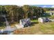 A sprawling property featuring a two-story home and a long driveway surrounded by lush trees at 3018 Corinth Church Rd, Monroe, NC 28112