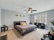 Spacious bedroom featuring a large window, gray walls, and a ceiling fan at 3018 Corinth Church Rd, Monroe, NC 28112