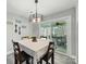 Inviting dining room with modern light fixture and outdoor access at 3018 Corinth Church Rd, Monroe, NC 28112