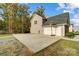 Detached garage with a basketball hoop and large parking pad at 3018 Corinth Church Rd, Monroe, NC 28112