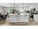 Bright, modern kitchen with stainless steel appliances, a large island, and an adjacent dining area at 3018 Corinth Church Rd, Monroe, NC 28112