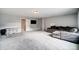 Spacious bonus room with comfortable seating and a large television at 3018 Corinth Church Rd, Monroe, NC 28112