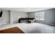 Large living room with neutral carpet, big window, gray sectional couch, and ottoman at 3018 Corinth Church Rd, Monroe, NC 28112