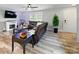 Cozy living room boasts a fireplace, ceiling fan, and plenty of natural light for a relaxing ambiance at 3018 Corinth Church Rd, Monroe, NC 28112