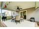 Covered patio featuring a ceiling fan, string lights, and outdoor dining set at 3018 Corinth Church Rd, Monroe, NC 28112