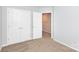Neutral bedroom featuring carpeting and a closet with double doors at 3138 Golden Dale Ln, Charlotte, NC 28262