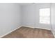 Neutral bedroom featuring a window letting in natural light and soft carpeting at 3138 Golden Dale Ln, Charlotte, NC 28262