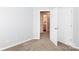 Neutral bedroom featuring carpeting with view into an attached bathroom at 3138 Golden Dale Ln, Charlotte, NC 28262