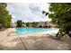 Large community pool with lounge chairs and a clubhouse creates the perfect recreation space at 3138 Golden Dale Ln, Charlotte, NC 28262