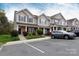 Inviting townhome exterior with manicured landscaping and a convenient parking area at 3138 Golden Dale Ln, Charlotte, NC 28262