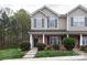 Traditional two-story home exterior with brick accents, manicured landscaping, and a covered front porch at 3138 Golden Dale Ln, Charlotte, NC 28262