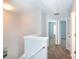 Open upstairs hallway featuring neutral paint, neutral carpeting, and an open doorway to another room at 3138 Golden Dale Ln, Charlotte, NC 28262