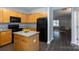 Cozy kitchen with light-colored cabinets, black appliances, and a center island at 3138 Golden Dale Ln, Charlotte, NC 28262