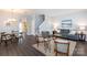 Open-concept living room featuring hardwood floors and modern decor with lots of natural light at 3138 Golden Dale Ln, Charlotte, NC 28262