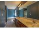 Bathroom featuring double sinks, a soaking tub, and modern fixtures at 3712 Autumn Gold Ct, Charlotte, NC 28278