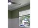 A bedroom showcasing modern blinds and white wainscoting at 3712 Autumn Gold Ct, Charlotte, NC 28278