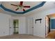 A bedroom showcasing a tray ceiling and blue accent at 3712 Autumn Gold Ct, Charlotte, NC 28278
