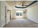 Spacious bedroom with a ceiling fan and a large window offering natural light at 3712 Autumn Gold Ct, Charlotte, NC 28278