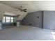 Spacious bedroom with plush carpeting, ceiling fan, and a built-in desk at 3712 Autumn Gold Ct, Charlotte, NC 28278