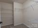 Walk-in closet featuring wire shelving for maximum storage and organization at 3712 Autumn Gold Ct, Charlotte, NC 28278