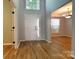 Inviting foyer featuring hardwood floors, a high ceiling, and a view into the dining room at 3712 Autumn Gold Ct, Charlotte, NC 28278