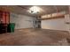 Large garage with overhead storage and ample space for vehicles and projects at 3712 Autumn Gold Ct, Charlotte, NC 28278