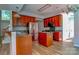 A well-lit kitchen featuring wood cabinetry, stainless steel appliances, and a central island at 3712 Autumn Gold Ct, Charlotte, NC 28278