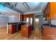 Modern kitchen with wood cabinets, granite countertops, and stainless steel appliances at 3712 Autumn Gold Ct, Charlotte, NC 28278
