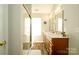 Updated bathroom with a glass shower, wood-look floors, double sinks and modern fixtures at 4002 Shadow Pines Cir, Indian Trail, NC 28079