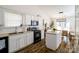 Updated kitchen features white cabinets, granite countertops, stainless steel appliances, and modern backsplash at 4002 Shadow Pines Cir, Indian Trail, NC 28079