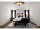 Spacious main bedroom features neutral decor, a ceiling fan, and a zebra print rug at 4002 Shadow Pines Cir, Indian Trail, NC 28079