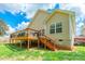 Back view of a raised deck overlooking a spacious lawn with a home featuring beige siding at 4058 Canvas Ave, Rock Hill, SC 29732