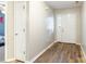 Bright foyer with wood-look flooring, closet and white double doors, creating a welcoming entrance at 4058 Canvas Ave, Rock Hill, SC 29732