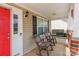 Covered porch with rocking chairs and a porch swing, perfect for relaxing and enjoying the outdoors at 4058 Canvas Ave, Rock Hill, SC 29732