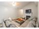 Inviting living room with a fireplace, large sectional sofa, vaulted ceilings, and ample natural light at 4058 Canvas Ave, Rock Hill, SC 29732