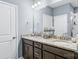 Bathroom with double sinks, a granite countertop, updated fixtures, and a walk in shower at 4112 Steel Way, Sherrills Ford, NC 28673