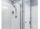 Modern shower with white subway tile, glass door, and chrome fixtures and finishes at 4112 Steel Way, Sherrills Ford, NC 28673