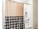 Clean and updated bathtub with shower and stylish shower curtain at 4112 Steel Way, Sherrills Ford, NC 28673