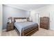 Comfortable bedroom featuring a wooden bed frame, soft carpet, and a nightstand with fresh flowers at 4112 Steel Way, Sherrills Ford, NC 28673