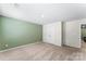 Spacious bedroom with neutral carpet and a closet with double doors at 4112 Steel Way, Sherrills Ford, NC 28673
