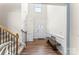 Bright entryway with a staircase, bench and high ceilings at 4112 Steel Way, Sherrills Ford, NC 28673