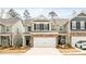 Charming two-story townhome featuring a two-car garage, neutral siding, and a manicured front lawn at 4112 Steel Way, Sherrills Ford, NC 28673