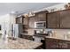 Modern kitchen featuring granite countertops, stainless steel appliances, and ample cabinet space at 4112 Steel Way, Sherrills Ford, NC 28673
