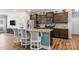 Kitchen island featuring granite countertops, stylish seating, and stainless steel appliances at 4112 Steel Way, Sherrills Ford, NC 28673