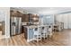 Kitchen island featuring granite countertops, stylish seating, and stainless steel appliances at 4112 Steel Way, Sherrills Ford, NC 28673