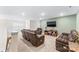 Spacious upstairs living room with plush leather recliners and a large TV on a wooden console at 4112 Steel Way, Sherrills Ford, NC 28673