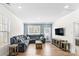 Cozy living room with a plush sectional sofa, a wooden coffee table, and a mounted television at 4112 Steel Way, Sherrills Ford, NC 28673