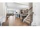 Open-concept living space with hardwood floors, dining area, and staircase, perfect for modern living at 4112 Steel Way, Sherrills Ford, NC 28673